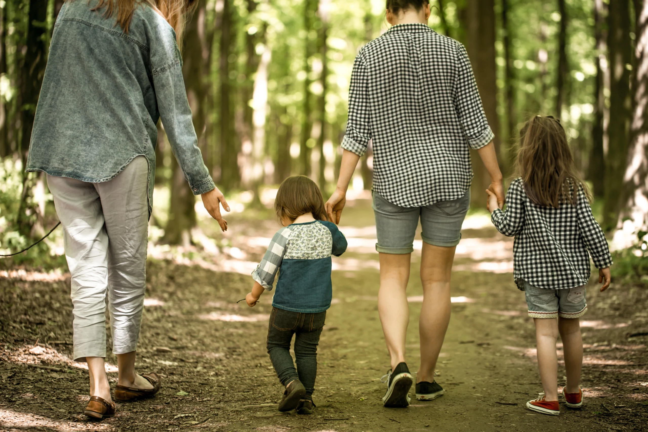 Toddlers playing or exploring with parents nearby.