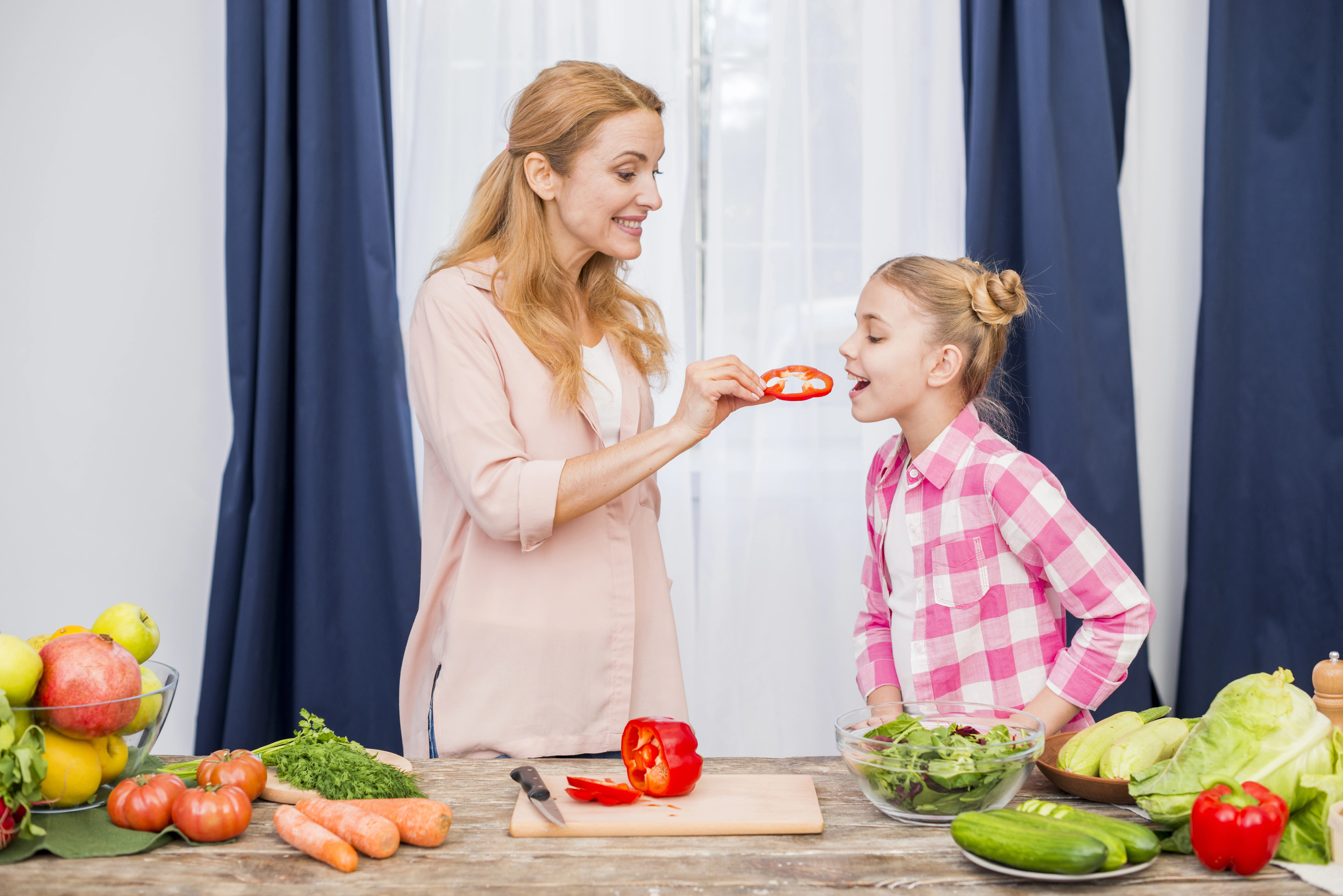 a mother feeding a child with Ayurvedic ingredients or an Ayurvedic consultation scene